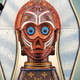 Ahsoka T-3PO is an unusual sculpture by Gabriel Dishaw. It features the Jedi's lekku, the droid's head painted red, orange, and blue, and a Louis Vuitton-styled base